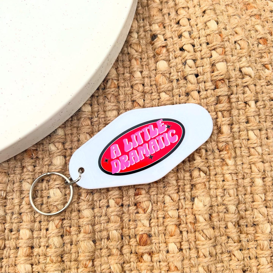 White Dramatic Keychain